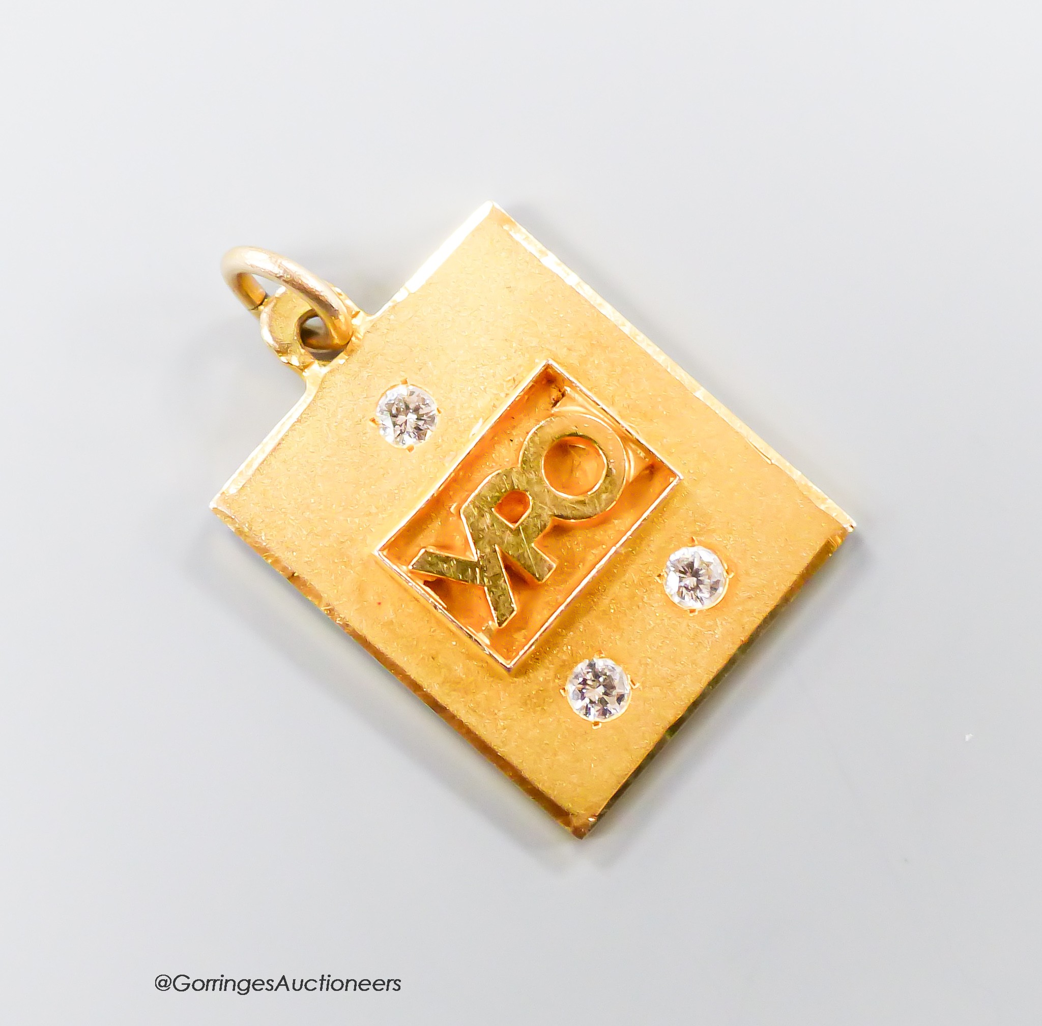 A yellow metal and three stone diamond set 